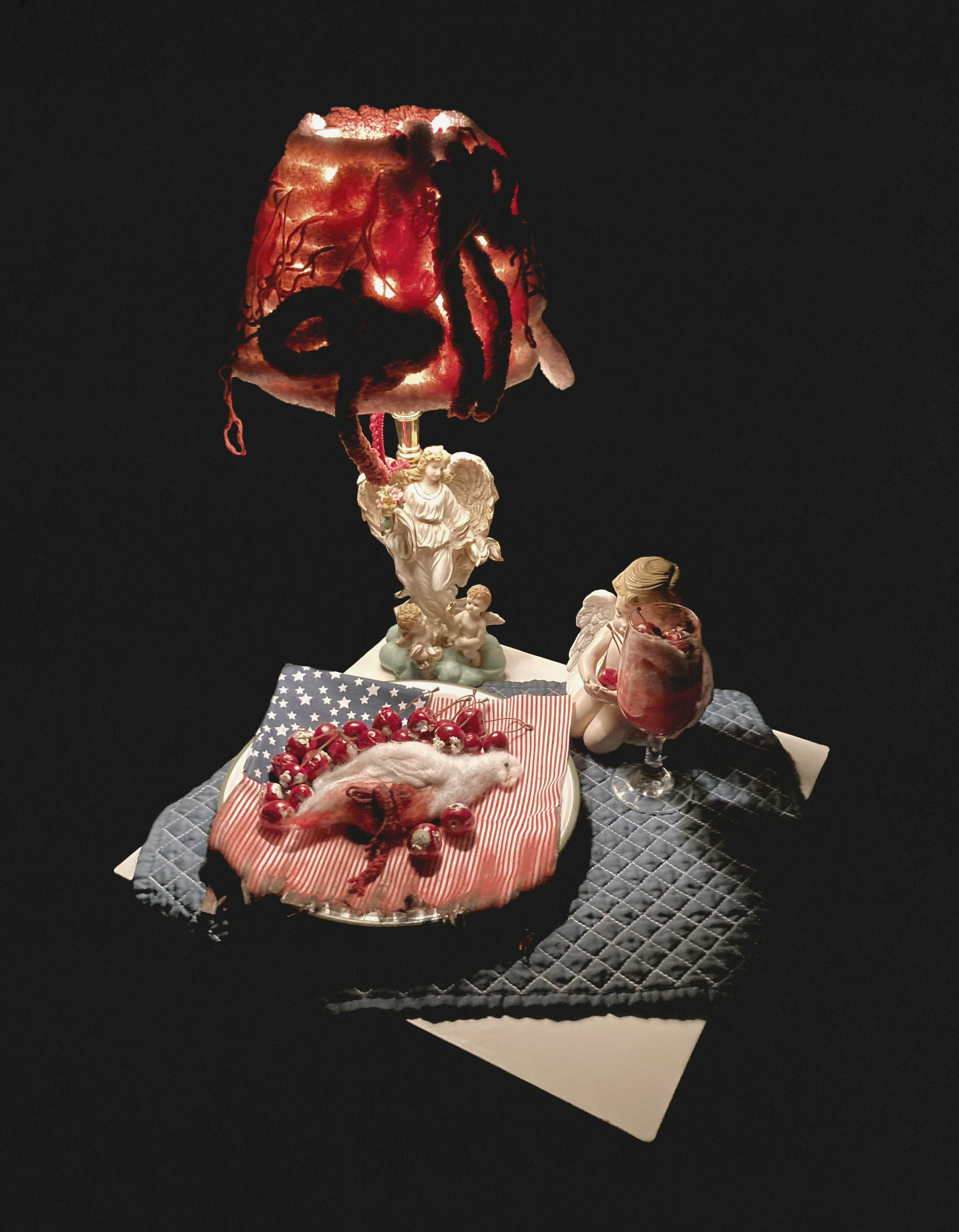 Cost of Freedom, needle felt, plastic cherries, ceramic plate, and fabric, 2023